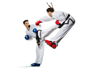 Karate woman in action isolated in white