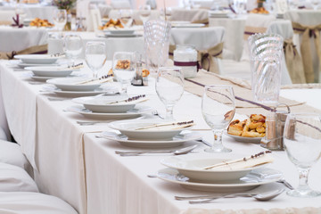 an image of tables setting at a luxury wedding hall