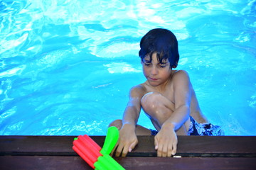 Boy with a water pistol