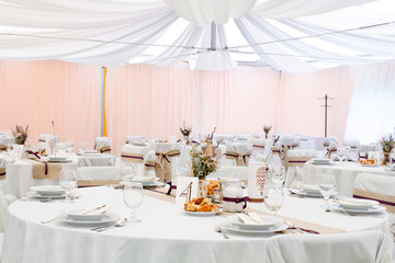 an image of tables setting at a luxury wedding hall