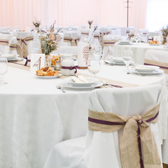 an image of tables setting at a luxury wedding hall