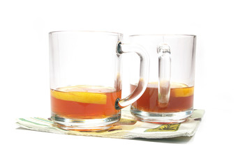 isolated cups of tea with a lemon