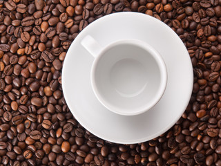 A white cup on beans background