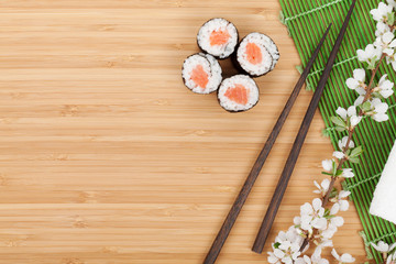 Sushi set, chopsticks and sakura branch