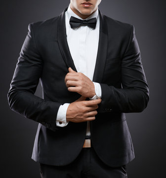 business man in suit on a dark background