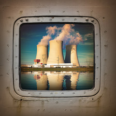 Nuclear power plant on the coast wiew from steel window.