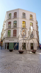 MALAGA - JUNE 12: City street view with cafeteria terraces and s