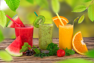 Fresh juice, healthy drinks on wooden table.