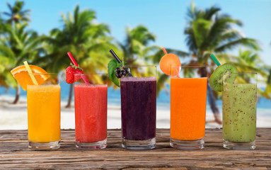 Fresh juice, healthy drinks on wooden table.