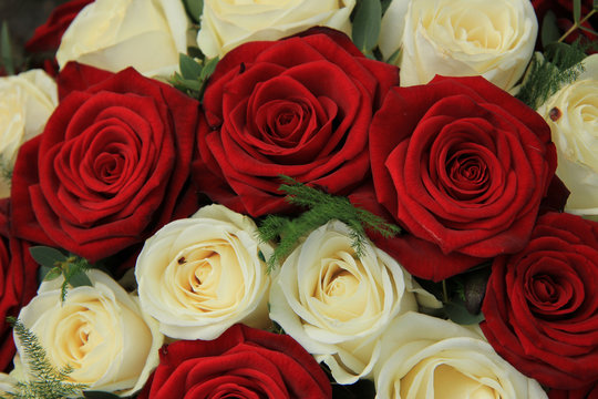 Red and white roses in a wedding arrangement