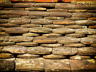 Old roof tiling texture, damaged and ruined.