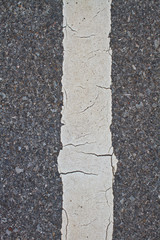 Obraz premium asphalt road with marking lines and tire tracks