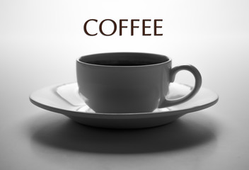 glass cup and saucer closeup with title coffee
