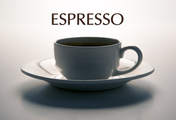 glass cup and saucer closeup with title espresso
