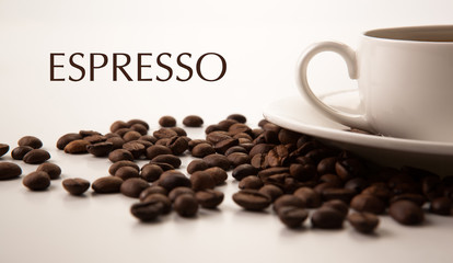 cup of black coffee with roasted coffe beans with title espresso