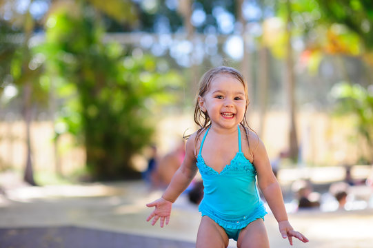 little girl in swimsuit have a fun on a vacation