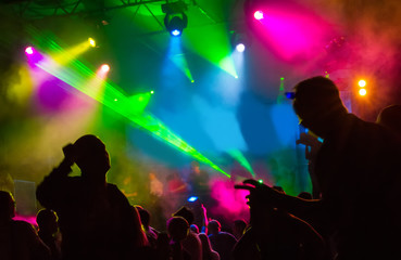 Dark Silhouettes of Dancing People in a Nightclub. Music Dj Crowd Neon  Event Show Party Edm