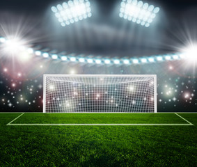 Soccer ball on green stadium arena