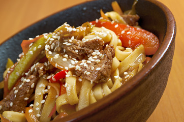 Cooking udon teppanyaki with pork
