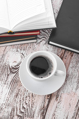 Cup of coffee on a wooden table