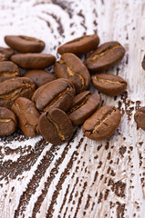 Coffee beans on wood background