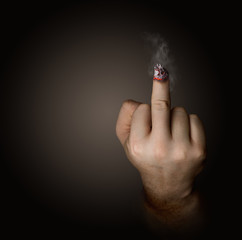 stop smoking concept. cigarette like a middle finger