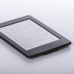 black ebook reader or tablet on white background