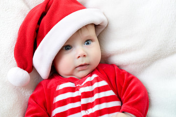christmas cute infant boy lying on soft plaid, beautiful funny i