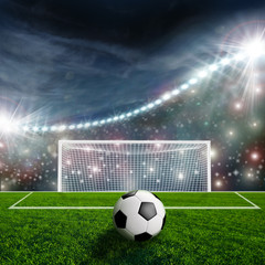Fototapeta na wymiar Soccer ball on green stadium arena