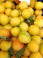Fresh plums at farmers market in Italy