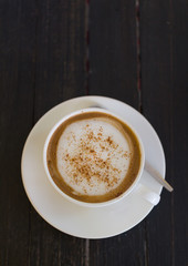 Fototapeta premium coffee cup on wood black table