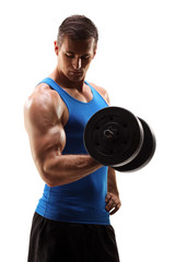 Fototapeta na wymiar Studio shot of muscular young man lifting barbell