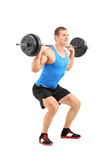 Fototapeta na wymiar Full length portrait of man lifting heavy weight