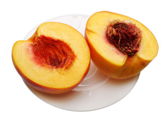 Sliced peach on the plate, isolated