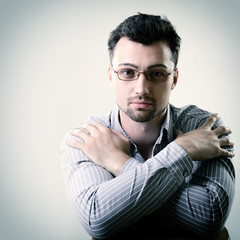 Portrait of handsome young business man in glasses