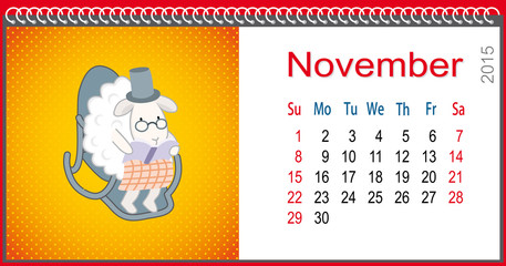 Calendar for November and lamb reading a book