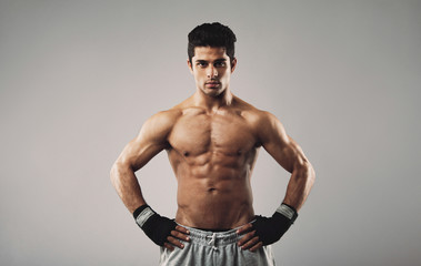 Fototapeta premium Young muscular man posing confidently