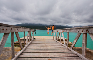 Fototapeta na wymiar A young couple cool off at Mystery Island, Vanuatu 
