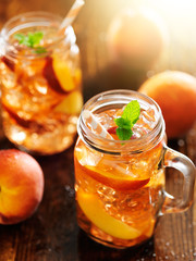 jar of peach tea shot vertically