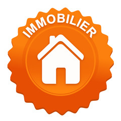immobilier sur bouton web denté orange