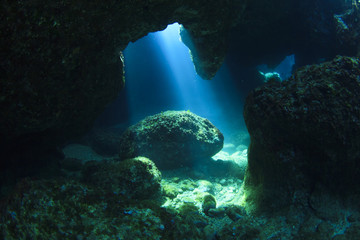 Naklejka na ściany i meble Sunshine in underwater cave