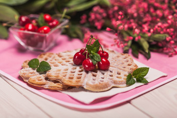 Close up of sweet waffles with cherries