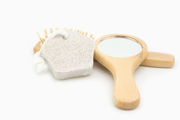 Fototapeta na wymiar Wood come scrub and mirror handle isolated on white