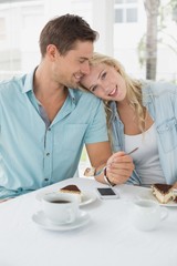 Hip young couple having desert and coffee together