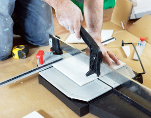 Man cutting ceramic tile