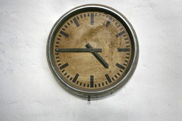 Old wall clock on white