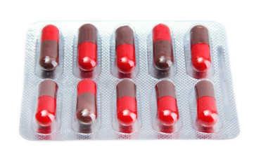 Capsules packed in blisters, isolated on white