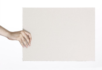 Cardboard frame in the hands on a white background