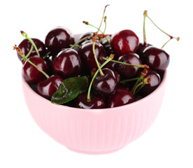 Sweet cherries in color bowl isolated on white