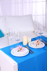 Festive table setting in interior